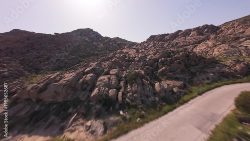 A cinematic FPV drone flight over unique smooth rock formations at Kolymbithres Beach on Paros island, Greece. Natural sculpted stones create an unusual landscape, perfect for travel, nature 