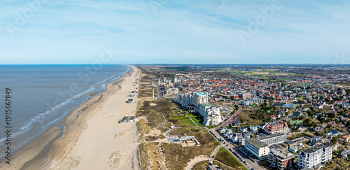 Tourist coastal resort town with sandy beach and promenade in Europe