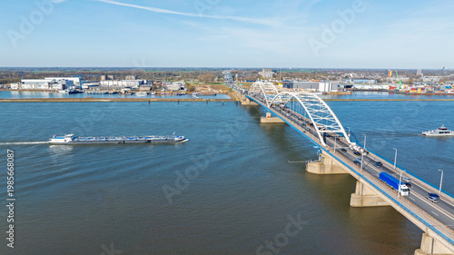 Highway traffic on a bridge across a wide river in Europe