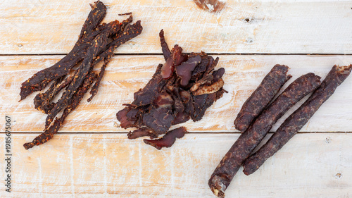 South African biltong and dry wors on rustic wooden table