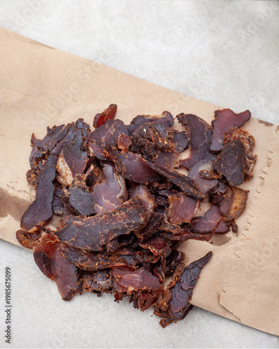 Sliced biltong on brown paper traditional South African dried meat