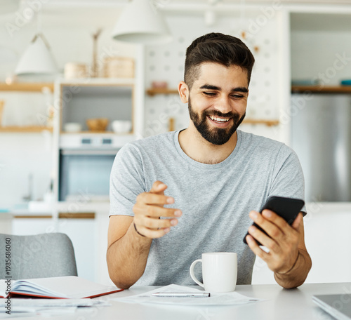 Portrait of a young man with a smartphone at home