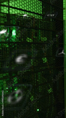 Vertical video: IT rack behind hex grill reacting to scan, icons aligning by green LEDs for status