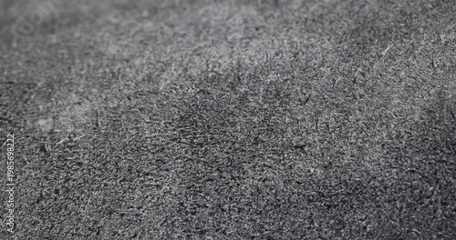 High contrast leather surface, black leather surface with a complex network of wrinkles and shiny peaks with an authentic look and clear organic material details.