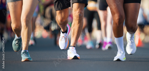 Marathon running race, people feet on city road, runners run urban marathon in the the city