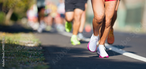 Marathon running race, people feet on city road, runners run urban marathon in the the city