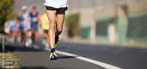 Marathon running race, people feet on city road, runners run urban marathon in the the city