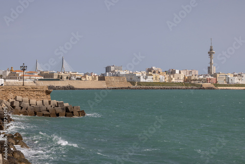 Gale Promenade (Paseo del vendaval) with breakwater and TV tower Tavira II (Torre Tavira II), Cadiz; Spain; Andalusia