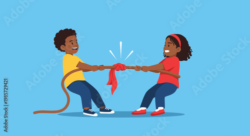 Happy young boy and girl playing a competitive and fun game of tug of war with a rope against a plain blue background.
