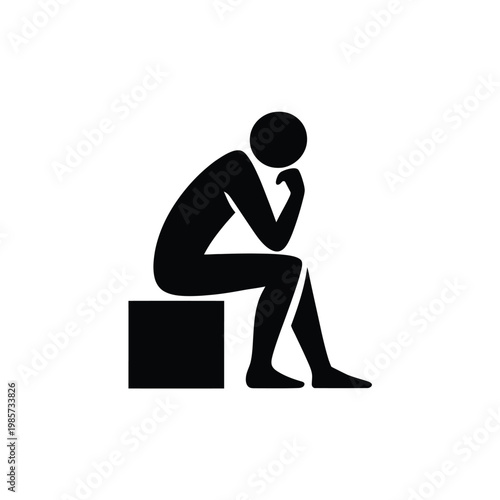 Silhouette of a person sitting in a thoughtful contemplative pose