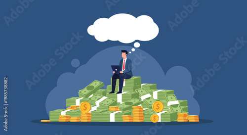 Successful businessman sitting on top of a massive pile of dollar bills and gold coins while working on his laptop.