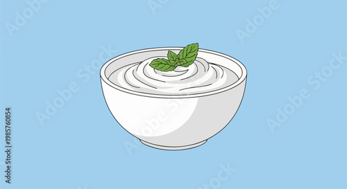 White bowl of creamy dessert with mint garnish on blue background