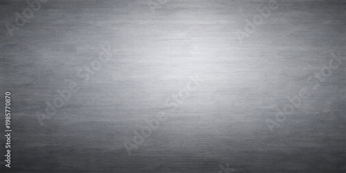 A shiny brushed metal plate texture features a silver stainless steel surface with a light metallic gray pattern designed for a sleek industrial wallpaper backdrop
