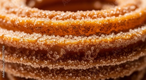 Close up macro shot of stacked cinnamon sugar churros.