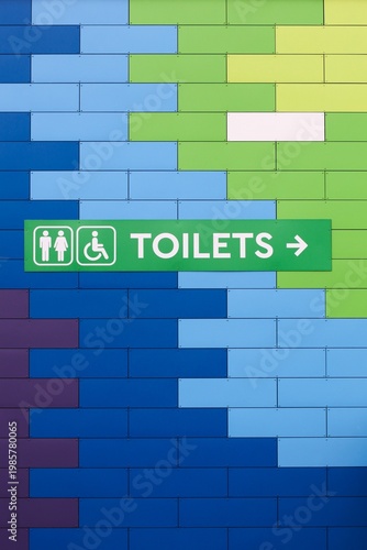 Toilet and restroom symbol on a colorful wall