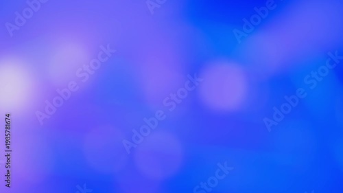 Blurred bokeh lights of a music concert stage with flashing blue and purple colors, creating an abstract defocused background for events and entertainment. Real time 4K Video.