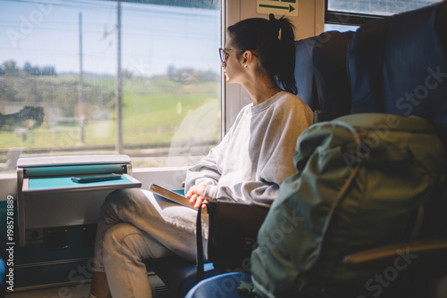 Woman traveling by train, enjoying quiet moments