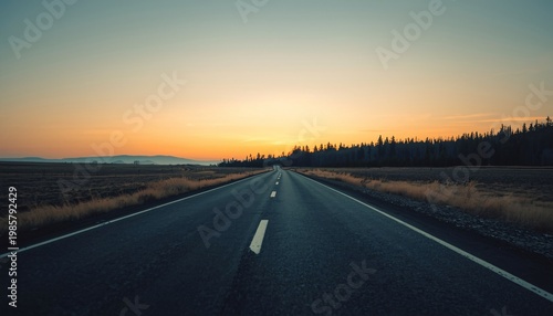 Open road at sunset with a clear path forward into a vast and beautiful landscape