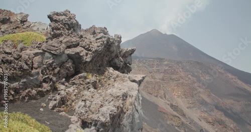 Stunning view of Etna Volcano in the background of a rocky cliff, Sicily, 4k