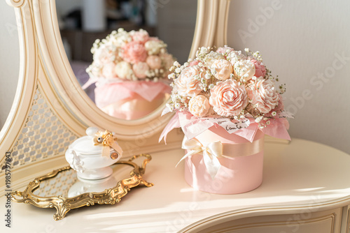 Tableau sur toile Bouquet of rose-shaped candles on elegant vanity table for home decor and giftin