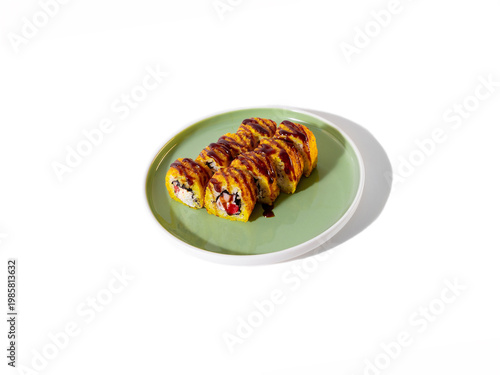 Charred sushi roll on vibrant plate with soft lighting for intimate dinner