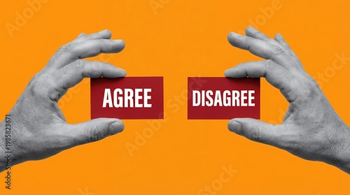 Two hands hold red cards with the words AGREE and DISAGREE in white text set against an orange background choice decision opinion difference opposition agreement contrast