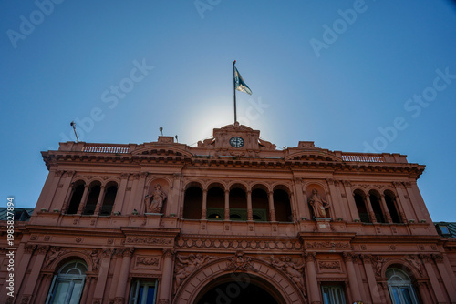 sun behind buenos aires casa rosada presidential palace