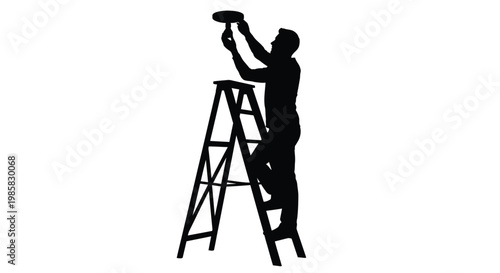 Silhouette of a man installing a light fixture on the ceiling with a ladder