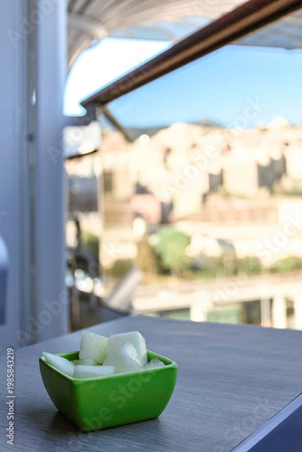 Cozy outdoor seating on cruise ship with food on table and curved decks in background leisure vacation concept.