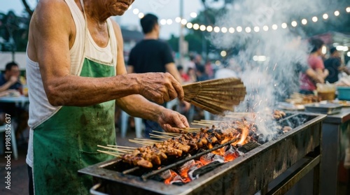 Street food vendor grilling satay chicken skewers on a charcoal grill