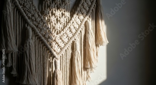 Sunlight Bathes Intricate Macrame Wall Hanging with Tassels and Detailed Weave