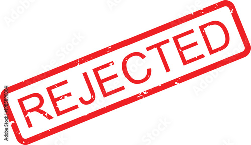 Red ink rubber stamp that clearly displays the word REJECTED on a clean flat surface