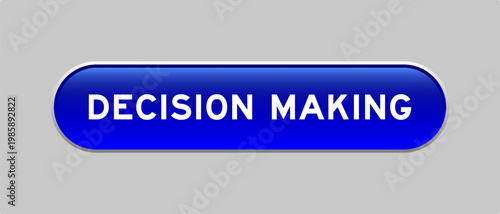 Blue color capsule shape button with word decision making on gray background