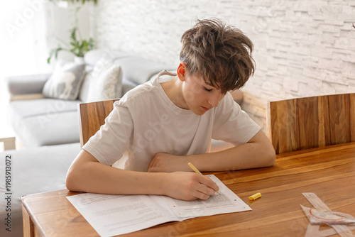 School boy, elementary school boy, preparing for exams for middle school at home