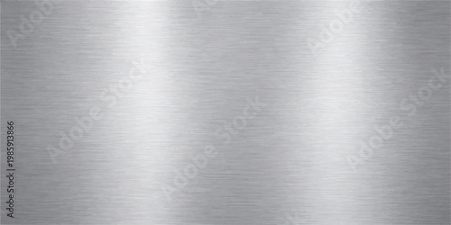 A polished stainless steel plate features a brushed silver metallic texture with a shiny industrial gray pattern on a smooth titanium and aluminum surface