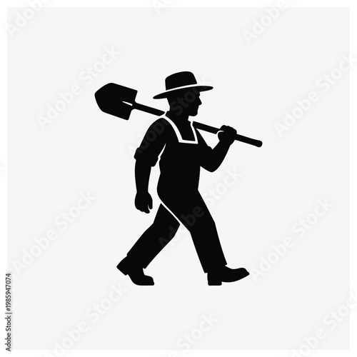 Worker or miner silhouette with shovel and hat