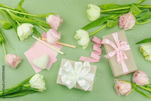 Happy Mothers Day concept. Gift boxes wrapped in craft paper and ribbons, handmade crocheted hearts