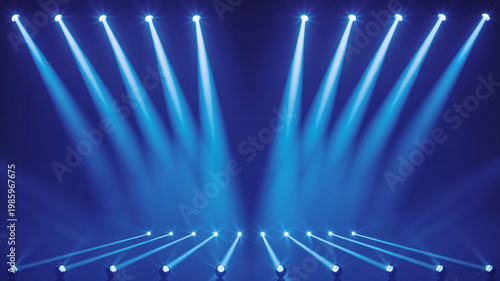 A dark blue background illuminated by multiple bright stage lights shining upwards and outwards.