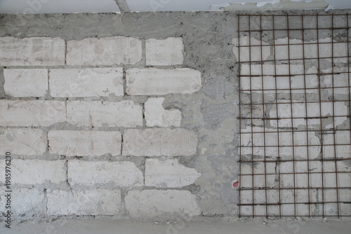 Wall made of limestone and rebar mesh. This image can be used as a background.