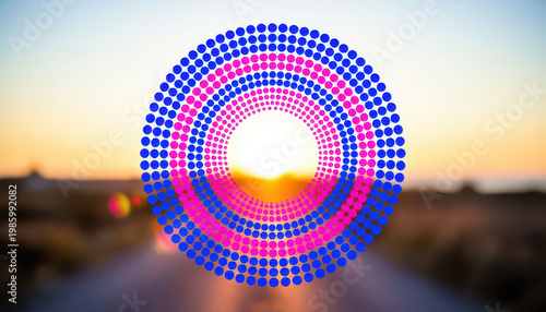 A vibrant sunset is visible beyond a road, with colorful circles overlaying the scene. The circles in various shades enhance the visual depth of the sunset.