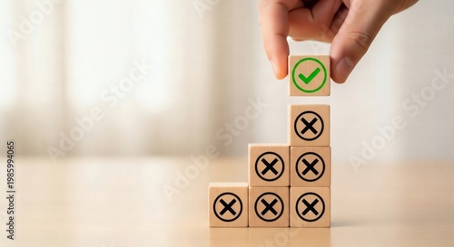 Business decision making concept. building success hierarchy with correct choice using wooden blocks hand placing green checkmark cube on top structured growth strategy.
