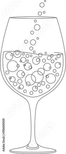A wine glass filled with bubbly liquid and rising bubbles