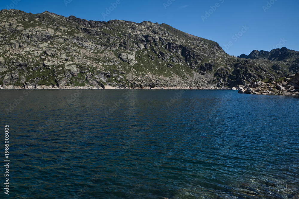 Fototapeta premium Estany Priimer de Juclar lake in Pyrenees mountains in Andorra