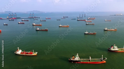 Aerial view of oil tankers anchored in a bay, supporting energy import and export for global transportation and industry.