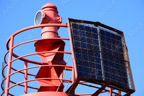 Reliable Red Navigation Aid Tower for Maritime Traffic in City Port Area