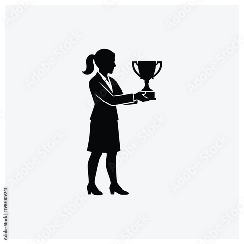 Silhouette of a woman holding a trophy