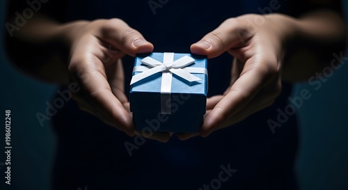 Heartfelt father's day gift hands holding a present with a ribbon celebrating dad