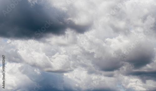 Fotografie Dark rain clouds cover sky creating dramatic storm atmosphere