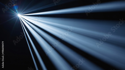 A bright light shining through darkness with beams of light radiating outward