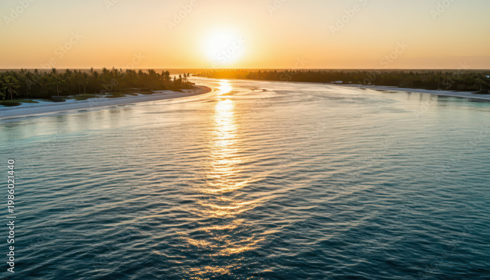 Obraz premium a calm waterway reflecting the sunset. The warm sunlight illuminates the river, surrounded by trees and a sandy shore.